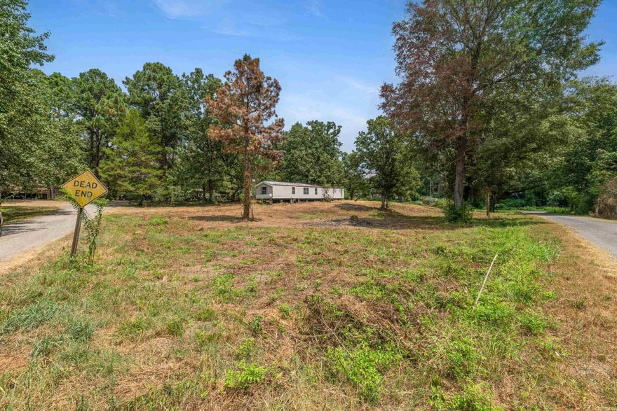 This .5 acre unrestricted and cleared lot across the street from Harris Brake has utilities on the property. There is a mobile home on the property but it needs work and is missing all electrical, plumbing and HVAC systems. Mobile home has been given no value. Property is as-is.