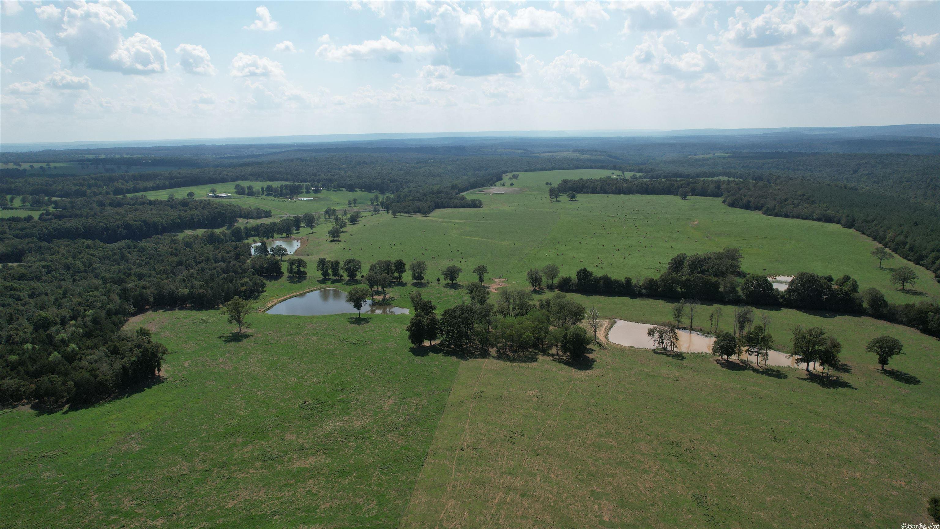 Beechfork Ranch at Hickory Flat has the unique distinction of being both a high producing cattle farm in fit and finish as well as a scenic retreat, loaded with outdoor recreation possibilities.  It marries the business and pleasure traits so seamlessly, you won't know whether to stare in awe at its' beauty or start working on your livestock plan.  It's a great piece of real estate for sure, but it's the details that really put it over the top.  Roads, drainage, fencing, cattle guards, herding lanes, barns.