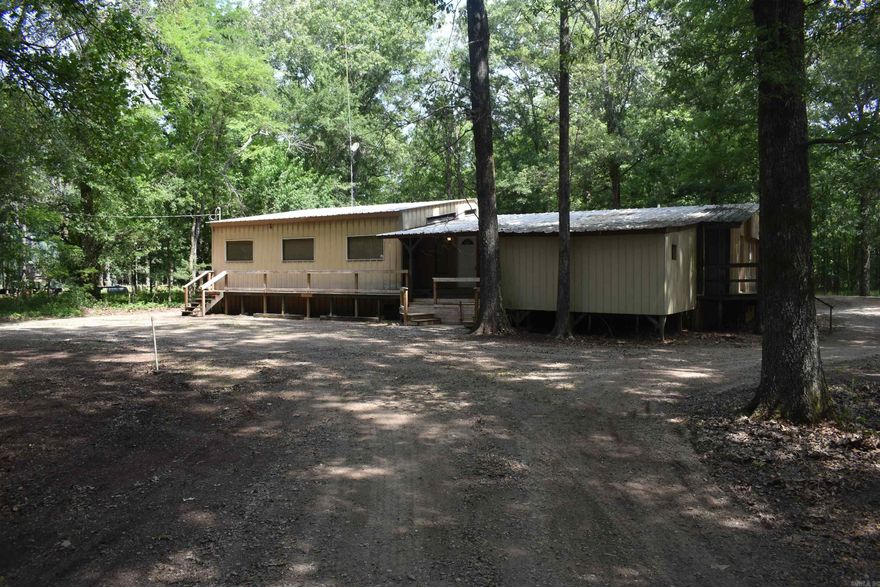 Rare opportunity to own a fully furnished camp.  The property is right down the road from Long Pond access, on the southern end of Bayou Meto WMA.  Saracen Casino is only approximately 20 miles away!  This spacious 2,320 sq ft, 5-bedroom, 4.5-bathroom camp is ideal for hunting groups.  The open-concept layout and recreational amenities make this a turn-key property you can enjoy from day one.