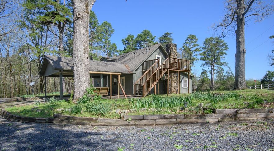 CHRISTIAN MOTORCYCLE ASSOCIATION nearby!  FREE yourself from the city to this updated COUNTRY HOME!  Perched on 5.54 acres of park like landscape, this LOW MAINTENANCE home has been impeccably maintained and offers a coveted view of the wildlife from upstairs on the spacious balcony and downstairs on the large patio. Newly installed A/C to keep you cool and a beautiful ROCK fireplace with a pellet stove and blower keep the home warm during the short winter.  Soaring wood ceilings in the upstairs bedroom suite create cabin feel and opens to the balcony, perfect for relaxing in the morning on the sundeck. Recent updates throughout the home enhance its appeal and functionality. The property includes a spacious 30x40 insulated SHOP has 220 and 110 electricity connected. There are two 10x15 finished rooms and a lean-to for implement storage or perhaps horse stalls.  Enjoy the peace and quiet of this low-traffic area, surrounded by towering 100-foot pine trees and mountain views. This home is a true retreat, offering a tranquil and picturesque setting for those seeking a peaceful lifestyle!