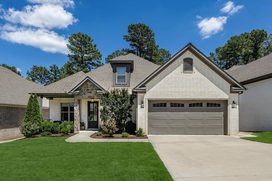 Welcome to 25 Waterside Drive in the heart of West Little Rock.  This stunning home features 4 bedrooms and 3.5 baths, perfectly designed for comfort and style.  The main level includes an office, a separate dining room connected to a gourmet chef's kitchen with double ovens, built-in microwave, refrigerator, and a 5-burner gas cooktop.  Enjoy ample space with a massive island and breakfast bar, and a bright eat-in kitchen opening to a spacious great room with 12 foot ceilings and expansive windows.  The covered back porch and fully fenced backyard are perfect for outdoor gatherings.  The primary suite boasts a cozy sitting area, and a guest bedroom with an ensuite bath is conveniently located downstairs.  Upstairs, you'll find 2 additional bedrooms and 1 bath.  Don't miss the great walk out attic storage!!!  The extra-large garage provides space for a workshop or a home gym.  This home combines luxury and functionality in a prime location.