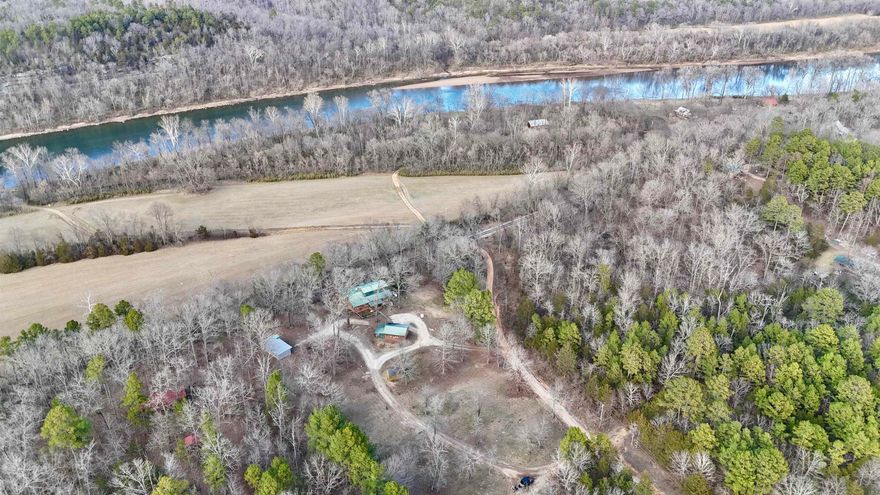 3 bedroom, 2.5 bath country home on 3.58 acres near the White River. This home features a large living area with tall ceilings, custom kitchen with granite countertops and an island! The primary bedroom is on the main level and includes a private screened-in porch, along with a full bathroom featuring a soaking tub, walk-in tile shower, large walk-in closet, and built-ins. A second bedroom is also on the main floor and has an attached room that could be used as extra storage, an office, or even a 4th bedroom. Upstairs you’ll find another bedroom and a half bath. Outside, the property is mostly open with mountain views, a circle drive, carport cover, storage building, and a shop with a newly installed storm shelter. Additional features include a new HVAC system, a generator, fiber internet, screened-in front porch, and more. Peaceful country setting with river access nearby, this one checks all the boxes.