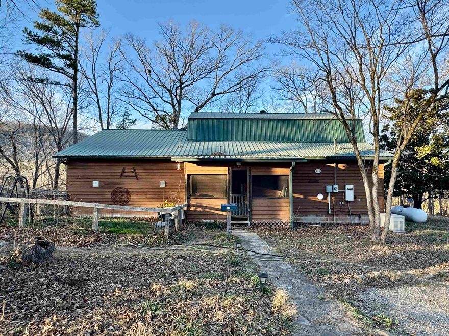 3 bedroom, 2.5 bath country home on 3.58 acres near the White River. This home features a large living area with tall ceilings, custom kitchen with granite countertops and an island! The primary bedroom is on the main level and includes a private screened-in porch, along with a full bathroom featuring a soaking tub, walk-in tile shower, large walk-in closet, and built-ins. A second bedroom is also on the main floor and has an attached room that could be used as extra storage, an office, or even a 4th bedroom. Upstairs you’ll find another bedroom and a half bath. Outside, the property is mostly open with mountain views, a circle drive, carport cover, storage building, and a shop with a newly installed storm shelter. Additional features include a new HVAC system, a generator, fiber internet, screened-in front porch, and more. Peaceful country setting with river access nearby, this one checks all the boxes.