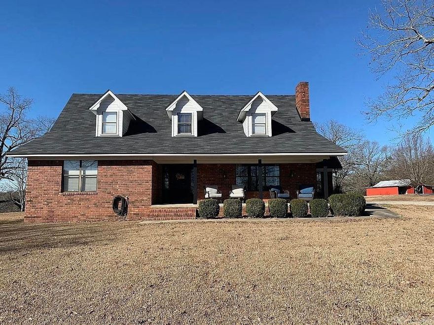 Charming Brick Home with Acreage Near Glenwood! Nestled on a hill just outside the Glenwood city limits, this move-in-ready country retreat offers the perfect blend of rural tranquility and convenient access to town amenities and only a couple of miles from the Caddo River. Situated on an expansive 10.66± acres with a picturesque red barn, this property is ideal for those seeking space and serenity. The home boasts 3 bedrooms and 2.5 baths, including a spacious primary suite conveniently located on the main floor, featuring a large closet for ample storage. The inviting living room includes a cozy fireplace, while upstairs you'll find two additional bedrooms and a full bath. Outside, enjoy a 3-car carport with an attached workshop, perfect for hobbies or storage. Additionally, the property includes a separate 200-amp electric meter to accommodate a camper, RV, or other equipment. Discover the charm of country living with the convenience of town just minutes away! AGENTS SEE REMARKS