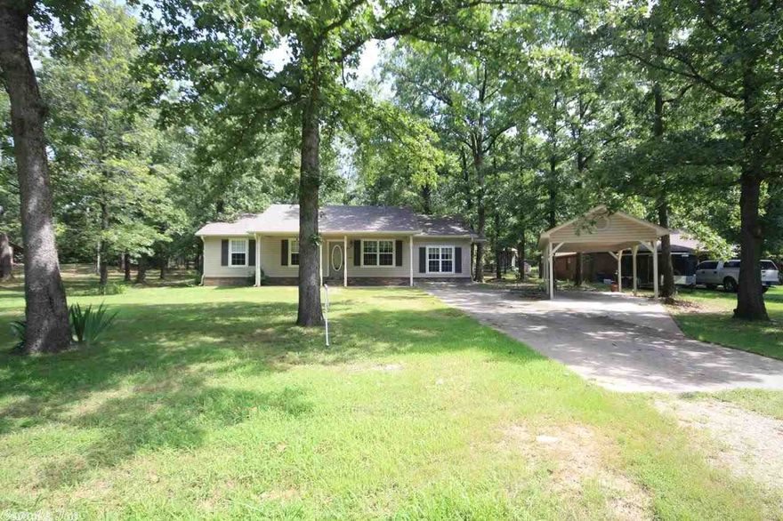 Nestled on a wooded lot is this recently refreshed home on 3/4 of acre.  New paint, new carpet, new counter tops give it a fresh look and smell!  Has 3BR/2BA w a small game room that could easily make a great 4th bedroom.  Also has a comfortable screen porch to watch the squirrels roam.  Detached from the house is a carport with sidewalk to the house.  Vilonia School District but 5 min from Conway city limits.  A commuter's delight!