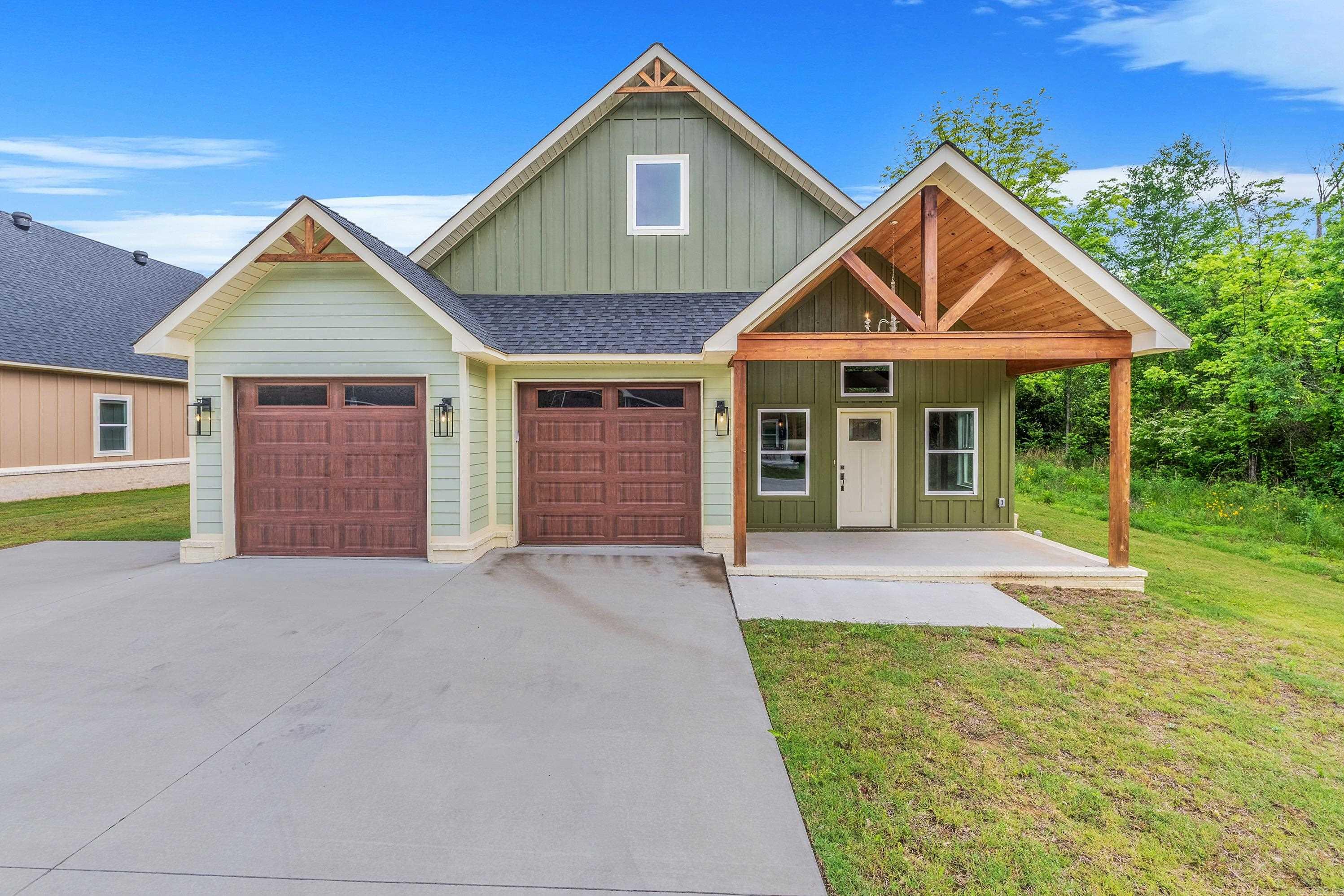 Charming New Construction in Greenbrier! This beautiful home features 3 bedrooms & 2 full bathrooms. The open layout includes a kitchen with a large quartz island, stainless steel farmhouse sink & soft-close cabinets & drawers. The living room has a gas fireplace and vaulted ceiling with exposed beams. The primary suite also has a vaulted ceiling with beam accents and a bathroom with double sinks and a gorgeous tiled walk-in shower. Durable and stylish LVP flooring runs throughout the home. You'll love the laundry room with cabinets and a built-in locker area. Additional features include storage space above the garage and a covered back patio—perfect for entertaining! Seller will pay up to $5000. of buyers closing costs with an accepted offer. This home is a must-see—schedule your showing today!