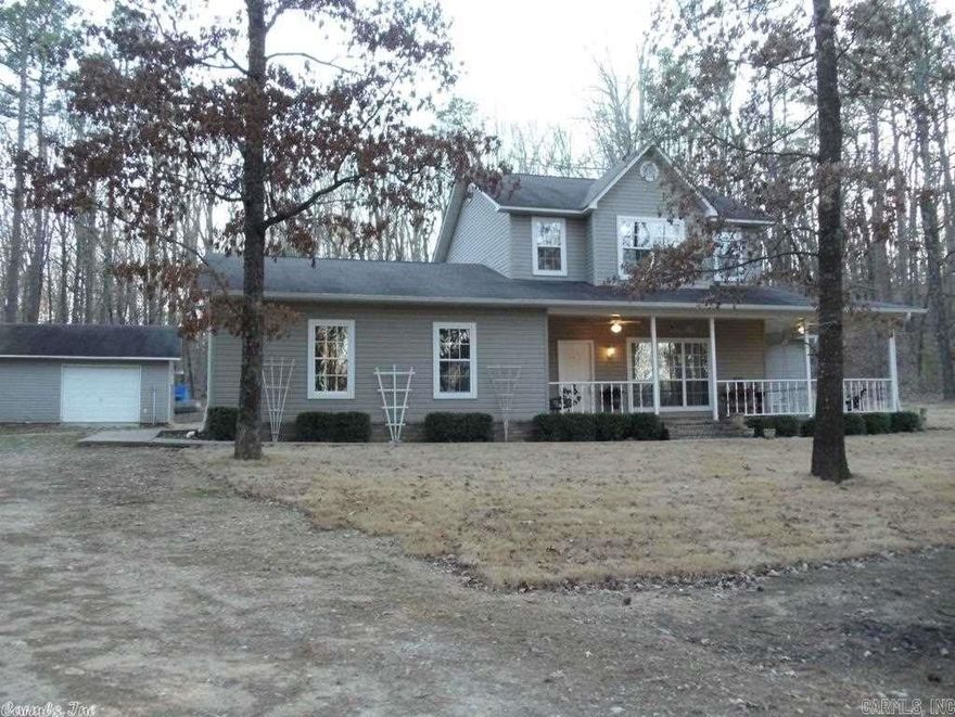 Peaceful, country retreat! Beautiful custom built  home on 3 secluded wooded acres! Wrap around porch is perfect spot for morning coffee and watching deer roam though. Private with no visible neighbors, yet close to town with great roads and nice homes in surrounding area. Kitchen has plenty of cabinetry and brand new stainless appliances. Living room has beautiful hardwood floors and gas log fireplace. Upstairs features 2 bedrooms and full bath plus a large game room. Bonus - 32x24 shop with electricity!!