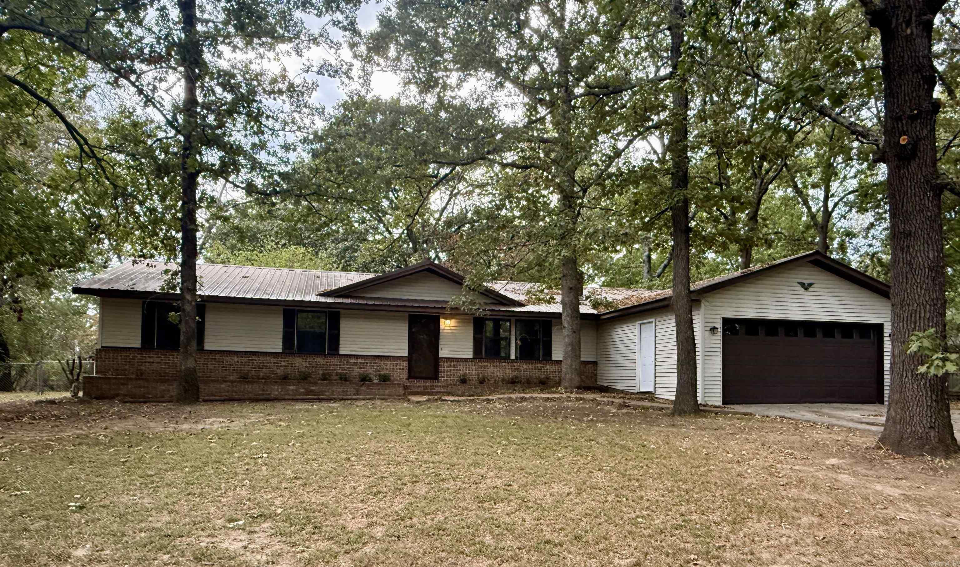 THIS PRICE WILL MOVE YOU! This recently updated 3-bedroom, 2-bath home in the well-established Clearview sub-division is WELL WORTH the CALL. Family room highlighted by a built-in bookcase, fresh paint, new flooring and a fireplace. RECIPE FOR SUCCESS in your step-saver kitchen with updated counter tops, a new sink, stove and freshly painted cabinets. Need more LIVING SPACE? Additional den is the perfect spot for a game room, playroom, or additional living room. Bedrooms are situated near one another with good closet space and size. HAVE A GREEN THUMB? Located on a 1-acre lot, the fenced backyard and detached storage building offer plenty of space for a garden and tools. Call today, and LET'S TALK DETAILS!