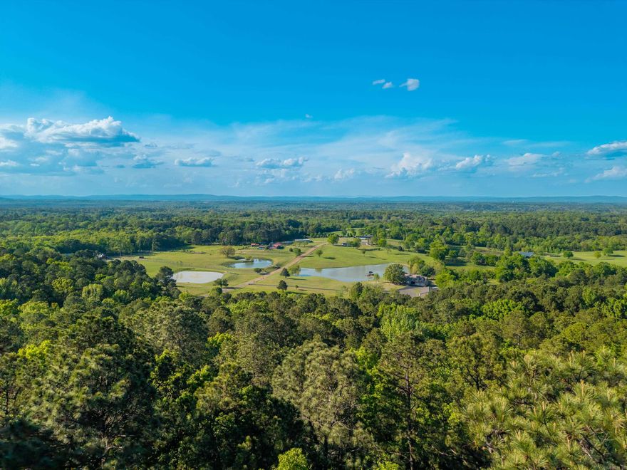 This expansive 10.7-acre estate just off Amity Road, offers a private, high-elevation retreat with significant potential for customization. The property is secured by a gated entrance and features a landscape defined by natural beauty, including mountain views and a private pond. some of the key features are 10.7 acres of beautiful land, 3 bedroom, 2 bath, enhanced privacy via a gated entrance.