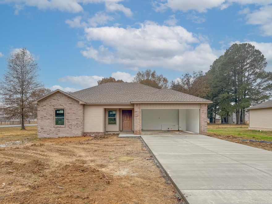 Welcome to your new home! This beautifully constructed 3-bedroom, 2-bathroom residence is perfect for those seeking both comfort and style. The open floor plan features an expansive living room that seamlessly flows into the kitchen area, making it ideal for entertaining and everyday living. The kitchen is equipped with granite countertops, a stylish tiled backsplash, and an abundance of cabinet space. Whether you're a culinary novice or an experienced chef, you'll appreciate the stainless steel appliances, built-in microwave, and dishwasher designed to elevate your cooking experience. The generous living room provides a welcoming space for family gatherings or a cozy night in, and the open layout ensures that the flow from the kitchen to the living area is effortless. Enjoy the outdoors in your large yard, complete with a concrete pad that's perfect for hosting BBQs, parties, or simply relaxing under the stars. Convenient parking is available with a 2-car garage, providing ample space for vehicles, storage, or a workshop. Don't miss the opportunity to make this stunning new construction your own. It's the perfect blend of modern amenities and classic charm. Call today to schedule!