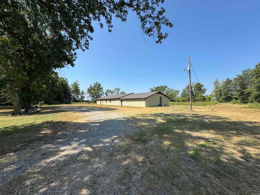 2nd PRICE IMPROVEMENT! If you are a duck hunter and own or lease property near the Fair Oaks area and want to add a lodge to your portfolio, give this one a look.  Listed at just under $65/ft2 you will struggle find an existing camp this nice or build one in this price range. Inside, it has been fully renovated with little to no use since the project was completed. The large, commercial Motak gas range and ovens convey and will easily prepare the largest meal you could imagine. It has 6 bedrooms (9 bunks for a total of 18 beds included) and 4 full baths so that you can give each member their own room and bathroom if you have a small group or easily sleep well over 20 people if you have a big crew. The exterior measures 110'x34' and is all metal, including the roof, making it a very low maintenance property to help keep your annual expenses and effort low. There is small pond behind the structure that provides an opportunity to create an outdoor entertainment space (fire pit, outdoor kitchen, etc) plus a place to train your dog in the afternoons. All pictured furnishings convey. Seller will entertain owner finance with 10% down required.
