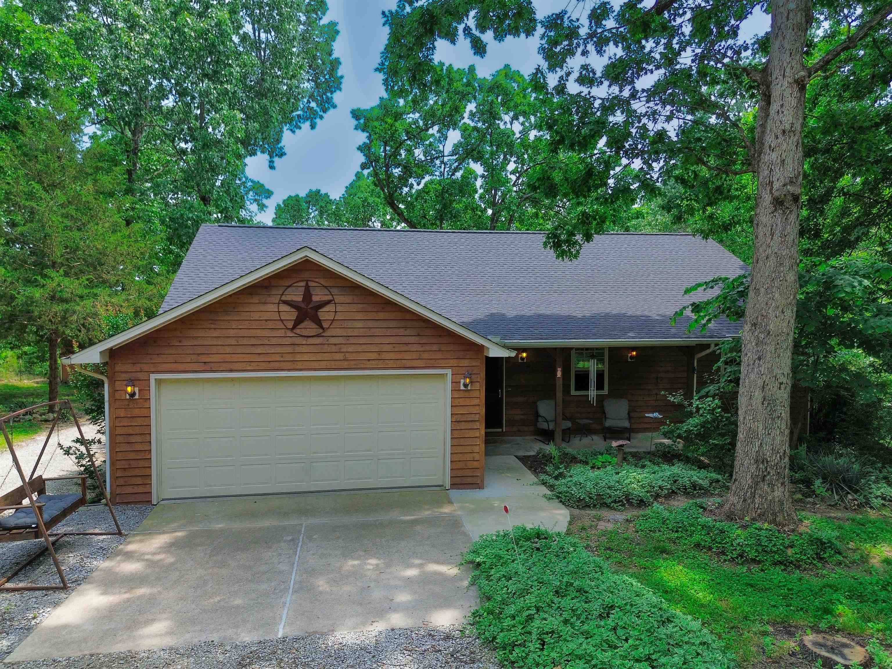 This beautifully updated 3-bedroom, 2-bath home sits on 3 peaceful acres just 5 miles from Norfork Lake access. Featuring an open floor plan with a split-bedroom layout, the home includes stainless steel appliances, a dedicated laundry room, and a screened-in patio that opens to a large deckāperfect for entertaining or enjoying quiet mornings. Recent updates include a brand-new roof in 2024, fully remodeled master and guest bathrooms in 2025, and luxury vinyl plank flooring throughout, adding both style and durability. The property offers incredible extras, including a 30x48 insulated shop with water, electric, and a car liftāideal for hobbies, storage, or a home business. For horse lovers, thereās a 4-stall barn, plus a private pond, fire pit, and park-like surroundings that offer both beauty and functionality. This is a rare opportunity to enjoy modern comforts with room to roam, just minutes from one of Arkansasās most scenic recreational spots.