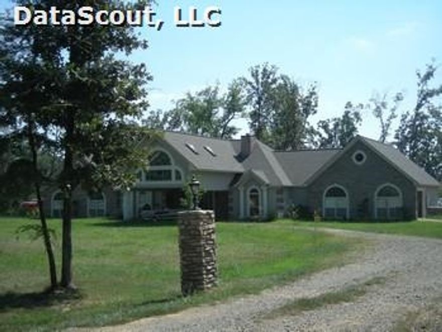 This is a fabulous custom built stucco and stone home with custom details through out the house. Gourmet kitchen with warming drawer, double oven (one confectioners oven), 6 burner gas cooktop, custom cabinets, built in refrigerator, trash compactor(all kitchen appliances will remain). Master bath has Jacuzzi tub, stand up shower, extra large master walk in closet. Italian ceramic tile floor, gas fireplace open to kitchen and livingroom. Extra blown in insulation. 440 sqft bonus room upstairs.