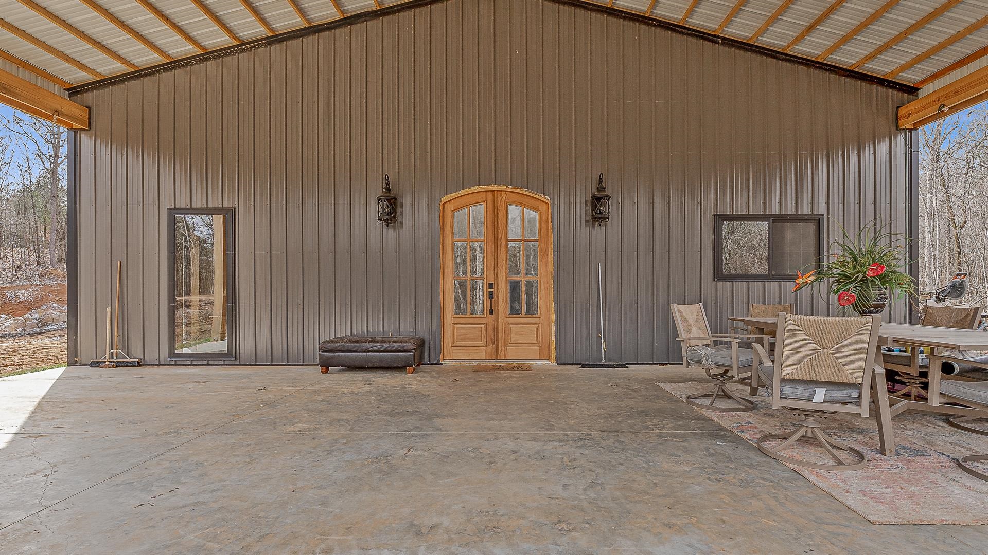 Welcome to 4822 Possum Hollow Road, a charming country retreat just outside of Harrisburg, AR, that perfectly balances rustic appeal with modern conveniences, . This newly constructed home sits on an expansive 10 acre lot, surrounded by mature trees and gently rolling hills, offering peace and privacy in a friendly, rural setting. Step inside to discover a light-filled, open-concept living area where the spacious living room flows seamlessly into a modern kitchen featuring new appliances, ample cabinetry, and a generous island perfect for casual dining and entertaining. The home offers three comfortable bedrooms, including a serene master suite complete with an en-suite bathroom and plenty of closet space. An additional well-appointed bathroom ensures convenience for family and guests. Outside, the large yard provides an ideal space for outdoor gatherings. A covered patio invites you to enjoy your morning coffee or an evening under the stars, while the generous lawn area is perfect for gardening, play, or simply soaking in the natural beauty of the surroundings. Contact us to schedule a private tour of this beautiful property!