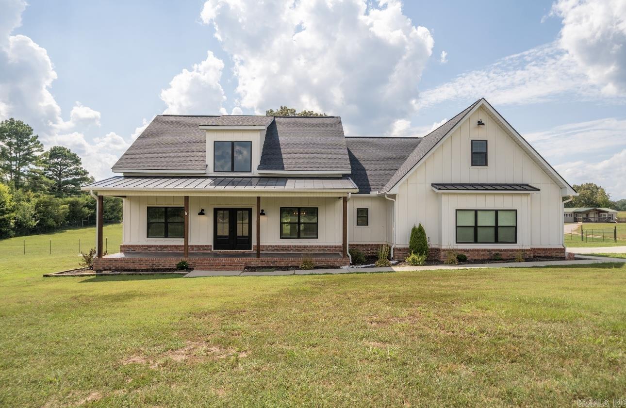 Welcome to your dream home! Set on 3.79 peaceful acres, this stunning Modern Farmhouse blends timeless charm with contemporary luxury. Featuring 4 spacious bedrooms and 3.5 beautifully designed bathrooms, there’s room for everyone to live, relax, and grow in comfort. The luxurious primary suite offers a tray ceiling, a large walk-in closet, and a spa-inspired en suite with automatic under-cabinet lighting, bringing both style and convenience. Step into a bright, open-concept living space filled with natural light and modern finishes. The heart of the home is a beautiful kitchen highlighted by a charming brick archway. Just off the kitchen, you'll find a butler’s pantry and a dedicated office space—perfect for remote work or daily planning. Outside, the expansive patio invites you to enjoy peaceful mornings, relaxing evenings, and unforgettable gatherings under the stars. This home is truly move-in ready — all that’s missing is you!