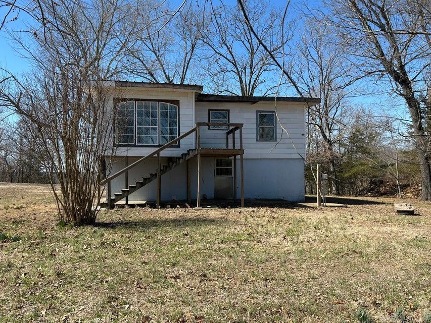 3 bedroom, two bath home in Hardy AR on .66 acres m/l. Upper floor has the kitchen, living room, bedroom and bathroom. Lower level has a living area and 2 bedrooms 1 bath. Great investment for rental or would make a great starter home with some work.