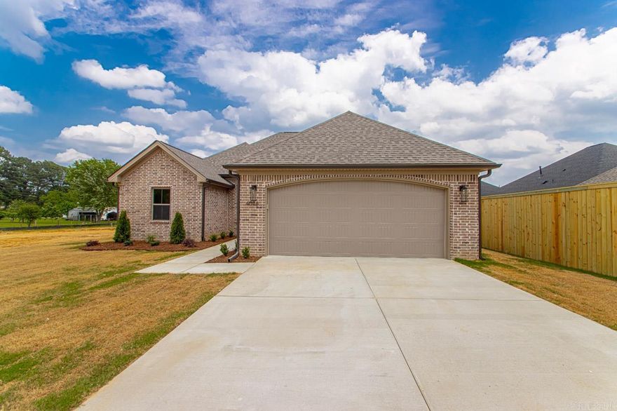 Welcome to your dream home in Benton’s premier subdivision, Spencer Crossing! This stunning brand new construction boasts a spacious four-bedroom, two-bathroom layout designed for modern living. Step into the heart of the home where custom-built, soft-close floor-to-ceiling cabinets adorn the kitchen, complemented by a freestanding stove & a convenient pantry for all your culinary needs. Cozy up by the brick gas fireplace in the open living area, perfect for entertaining or relaxing evenings at home. Retreat to the private primary suite featuring a luxurious primary bath complete with double vanities, a freestanding soaker tub, and a large walk-in tile shower, offering a spa-like oasis right at home. The split floor plan ensures privacy with spacious spare bedrooms, providing ample space for family or guests. Step outside onto the covered porch & immerse yourself in the tranquility of the backyard, where you’ll love spending time in the expansive, fully fenced outdoor living space. Whether it’s morning coffee or evening gatherings, this home offers the perfect setting for enjoying the outdoors. Don’t miss out on the opportunity to make this beautiful home yours!