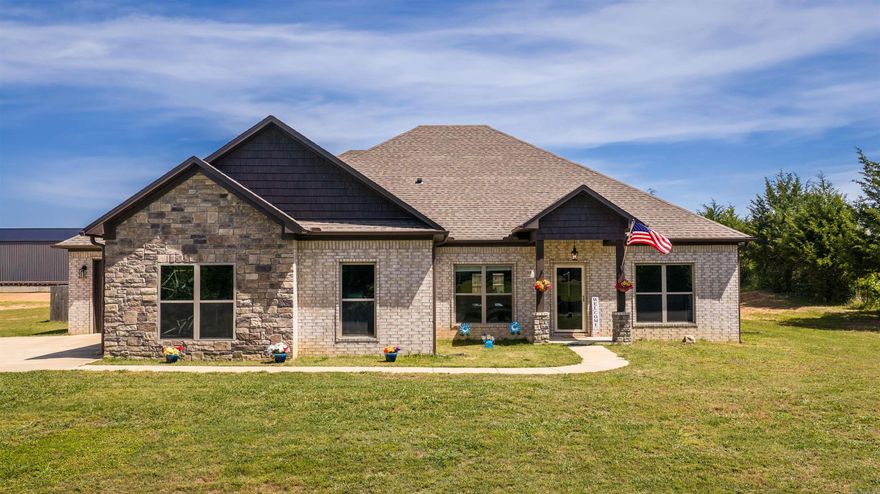 Welcome home to this stunning 2022-built property sitting on 2 beautiful acres in Greenbrier! This 4 bedroom, 2.5 bathroom home offers a spacious layout with luxury vinyl flooring, a cozy gas fireplace, and a thoughtfully designed kitchen featuring double ovens, a pantry, and plenty of space for entertaining. The primary suite includes a soaking tub and dual closets for added comfort and convenience. Outside, you’ll love the fenced yard, covered patio with extended concrete pad, gutters, and oversized driveway space. Complete with a 3-car garage and modern finishes throughout, this home blends comfort, style, and functionality in one incredible package.