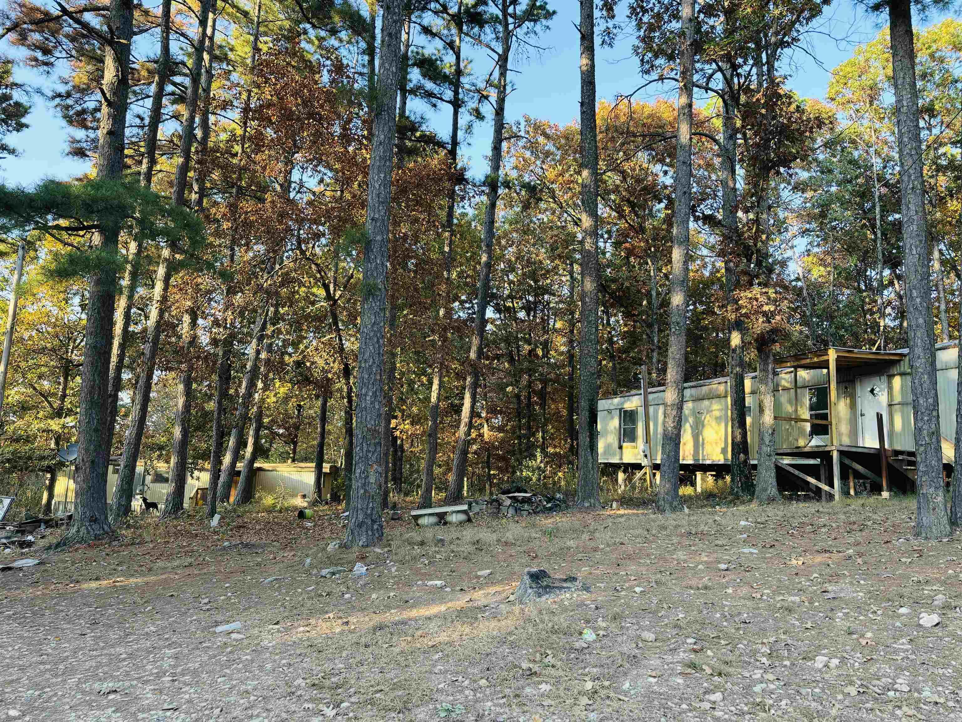 Near Mountain View and White River! This mostly wooded property contains 2.20 acres MOL in beautiful Mountain View where you can enjoy music, shopping, and eateries. The world renown White River with world class Trout fishing is also just a few minutes away. This property is income producing with 2 mobile homes currently used as monthly rentals. One is a 10X48 and the other 12X47. Call today for more information or to set up a time to view.