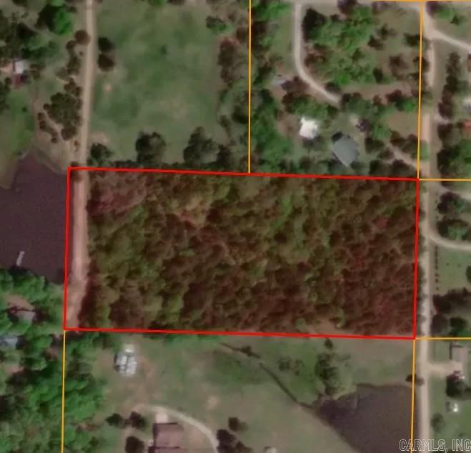 If you are looking for a private country location to build your forever home or looking for your weekend getaway, take a look. 4.92 acres of wooded land, lays good, elect., phone, fiber optic, and city water available. You are just minutes from town, but in a private setting. The land lays great giving you several options for building sites.