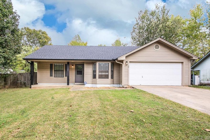 Cute 3BR 2BA 2 Car garage. Perfect starter home! Cathedral ceiling in living room with gas log fireplace, Split floor plan, this home has lots of updates, including, new vinyl plank flooring, new cabinets, counter tops and back splash, appliances, light fixtures, paint, master shower, plumbing fixtures, doggy door and new roof.  Privacy fenced back yard, Close to schools and shopping. Don't wait! This one won't last!