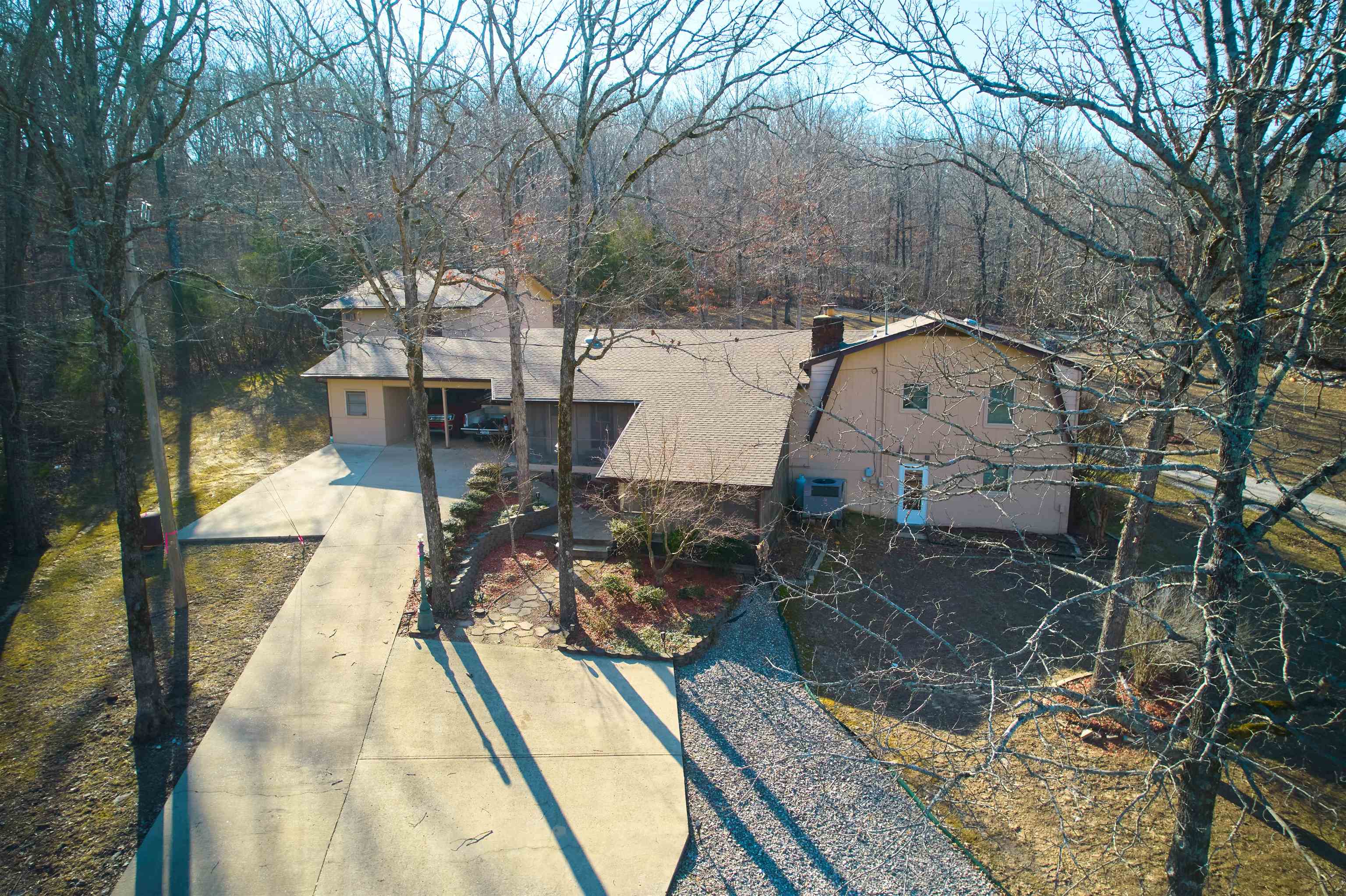 LAKEVIEW Custom Built Home located at Rainbow Lake! 14 ACRES unrestricted!! This country estate has about 12 acres of woods with a live creek meandering through it about 2 acres open . Perfect for a volley ball/badminton games osr outdoor activities Property has city water and city sewer. Seller is offering an adjoining lot for access to 2 private lakes for fishing and boating. Nestled among large shade trees, it is private & secluded. So many features its hard to list them all! 4bdr 3b with detached 3 car garage and large finished game room/storage w/ possibility to be a separate apartment above the garage. Convenient circle drive. Custom kitchen with breakfast bar that is open to den w/ fireplace that can be wood burning, gas or electric. Large Dinning Room / Formal Living room with custom built-ins. Master bedroom and huge closet with room to spare! Finished basement with large bedroom and bonus room and so much more!! This is a MUST SEE!!