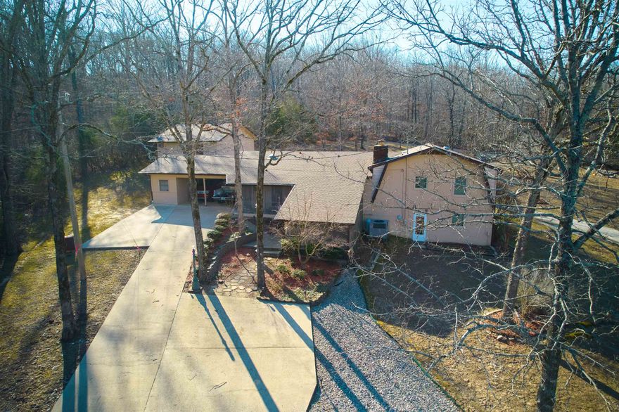 LAKEVIEW Custom Built Home located at Rainbow Lake! 14 ACRES unrestricted!! This country estate has about 12 acres of woods with a live creek meandering through it about 2 acres open . Perfect for a volley ball/badminton games osr outdoor activities Property has city water and city sewer. Seller is offering an adjoining lot for access to 2 private lakes for fishing and boating. Nestled among large shade trees, it is private & secluded. So many features its hard to list them all! 4bdr 3b with detached 3 car garage and large finished game room/storage w/ possibility to be a separate apartment above the garage. Convenient circle drive. Custom kitchen with breakfast bar that is open to den w/ fireplace that can be wood burning, gas or electric. Large Dinning Room / Formal Living room with custom built-ins. Master bedroom and huge closet with room to spare! Finished basement with large bedroom and bonus room and so much more!!  This is a MUST SEE!!