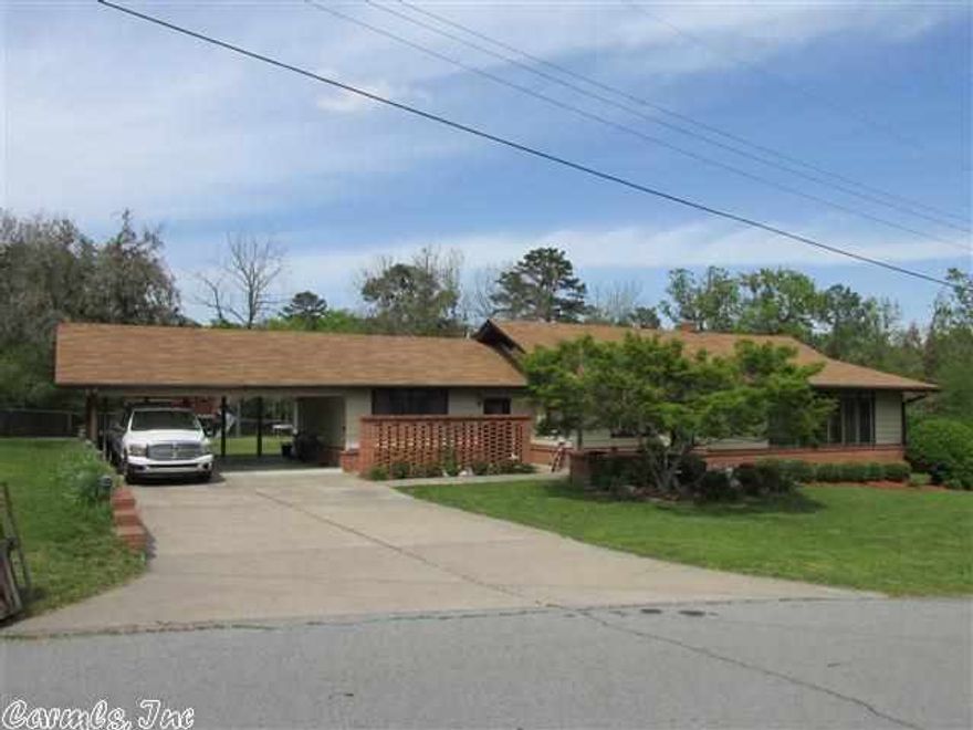 Wonderful, large family home conveniently located close to school.  Plenty of room inside and out for all the activities of a busy family.  Original hardwood floors under carpet in LR/DR. Home has all the extras including extra insulation and tons of storage. Sound-insulated playroom. 16'x45' heated and cooled shop with full bath. Deck. Storm shelter. Pretty landscaping. Fenced back yard.  A LOT FOR YOUR MONEY!!!! Call for an appointment today! (Agents see remarks.)