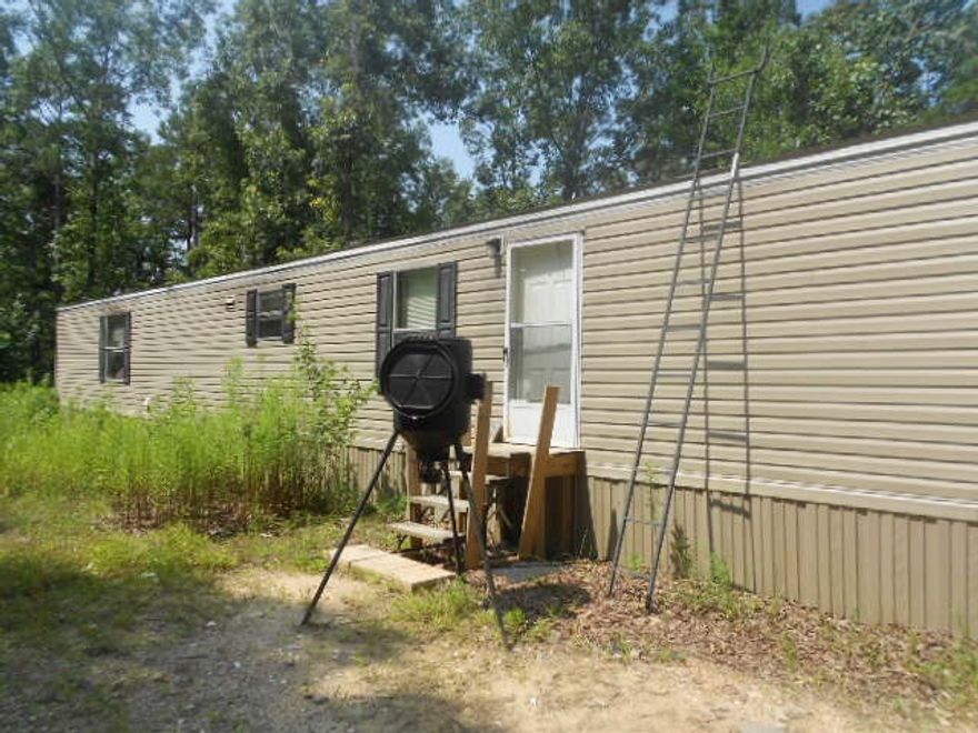Priced to move this newer mobile home on 4.5 acres in LHSD. Quiet secluded area of tree shaded acreage. Perfect for investor or owner occupant. You won't find a nicer place to live in LHSD for this price!