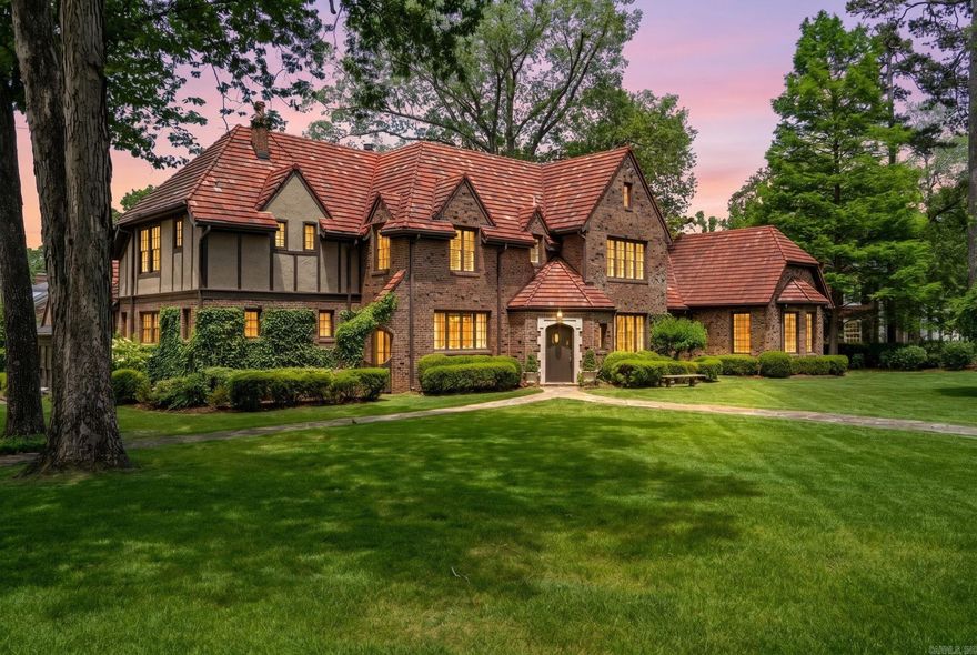 The most exquisite estate located in the Edgehill addition of the Heights. Fabulous in every way! Extraordinary architecture, beautiful detail, quality craftsmanship and timeless appeal make this the very ultimate setting for family living and entertaining! Outstanding family floor plan with luxurious primary on the main level. Step inside the gorgeous entry which is flanked by formal banquet dining and inviting living formal living. Gourmet kitchen that flows into sunny breakfast area and spacious family den with fireplace and vaulted ceilings and French doors that lead to terrace and spectacular grounds and pool along with covered outdoor living space. Handsome den with built-ins, bar and fireplace with beautiful views across the grounds. The private primary suite is located in the east wing with lounge and his/her baths.  Upstairs: 2 oversized bedroom suites and 2 additional guest rooms with shared bath. Oversized lot with stunning landscape and grounds. Garage with storage. Truly an exceptional place to call home!