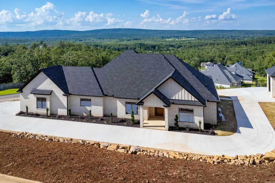 Featuring a spectacular view, this elegant and meticulously crafted home offers 4 Bedrooms (4th bedroom could be an office) , 3 1/2 Bathrooms on a 0.95-acre lot in the highly sought-after gated community of Waterview Estates. Inside, herringbone wood floors span the main level, complemented by matching wood flooring throughout. The gourmet kitchen features white marble countertops and all-new stainless-steel appliances, custom cabinets, while custom double-pane windows, a whole-house AV system, and foam insulation provide comfort and efficiency. Luxury details include custom showers, frameless glass doors, Kohler fixtures, heated primary-bath floors, and three electric fireplaces. Enjoy a glass-lined sunroom, large covered porch with grill area, air-conditioned garage, wrap-around drive, and a 20×30 heated and cooled detached shop. The home also includes a 30KW Generac  whole house generator and variable-speed high-efficiency HVAC.  Come See!!