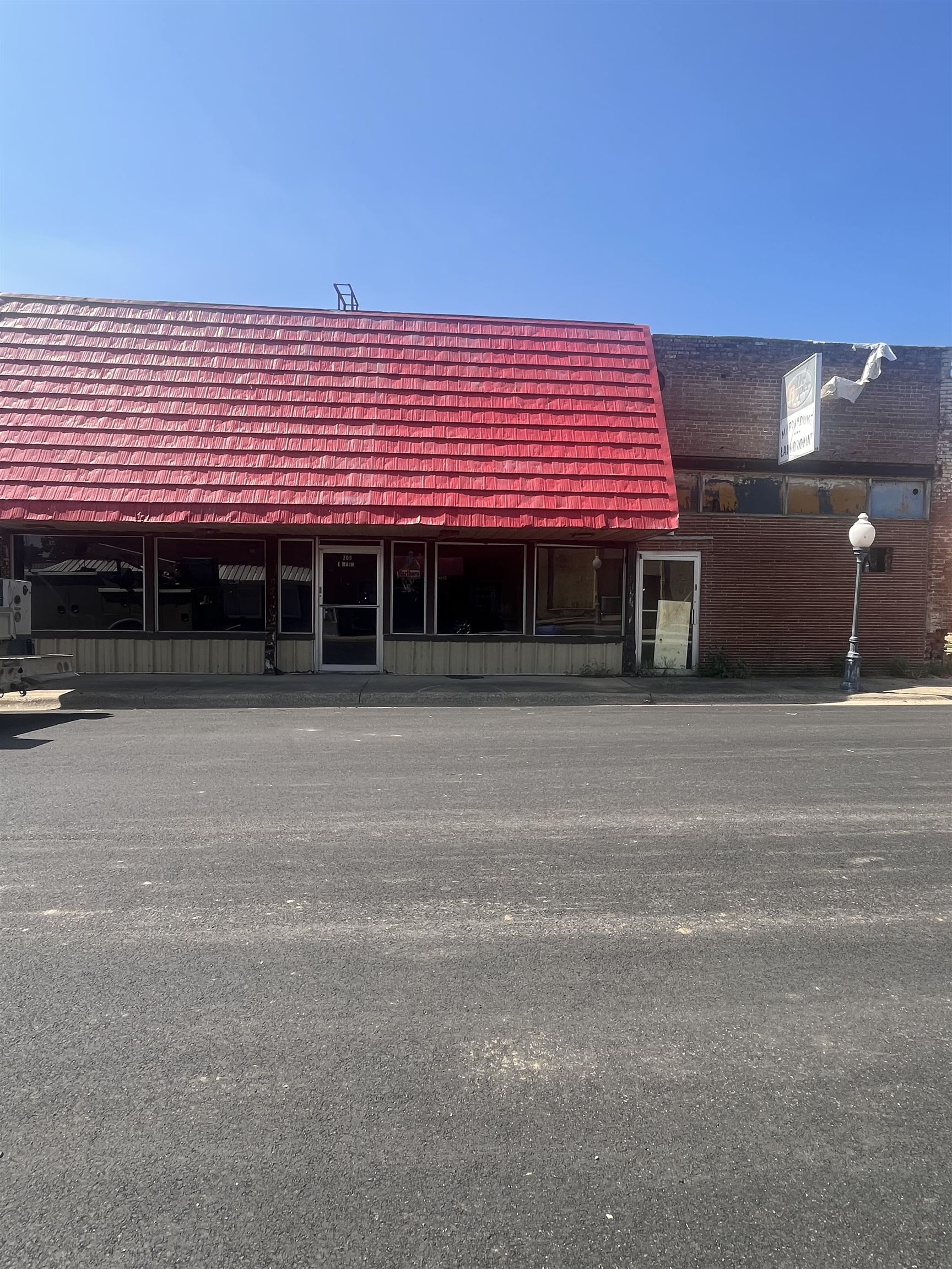 207 & 209 E Main Street, Marmaduke, AR Commercial Investment Opportunity This is a rare chance to own two adjoining commercial properties located in the heart of downtown Marmaduke. Both 207 and 209 E Main Street are being sold together and offer substantial potential for the right investor or business owner. These buildings will require extensive renovations, but their location and layout provide a wide range of possibilitiesretail storefronts, office space, service-based businesses, or even a mixed-use setup. Whether you're looking to open your own business or renovate and lease for income, this is a blank canvas ready for your vision. In addition to the commercial space, the rear of 209 E Main Street features a one-bedroom apartment with a laundry area. This unit was previously rented for $350/month and is currently vacant, offering an opportunity for residential rental income once updated. This is an ideal opportunity for a buyer with a creative mindset and a willingness to restore and revitalize two buildings in a growing community. Please see agent remarks.