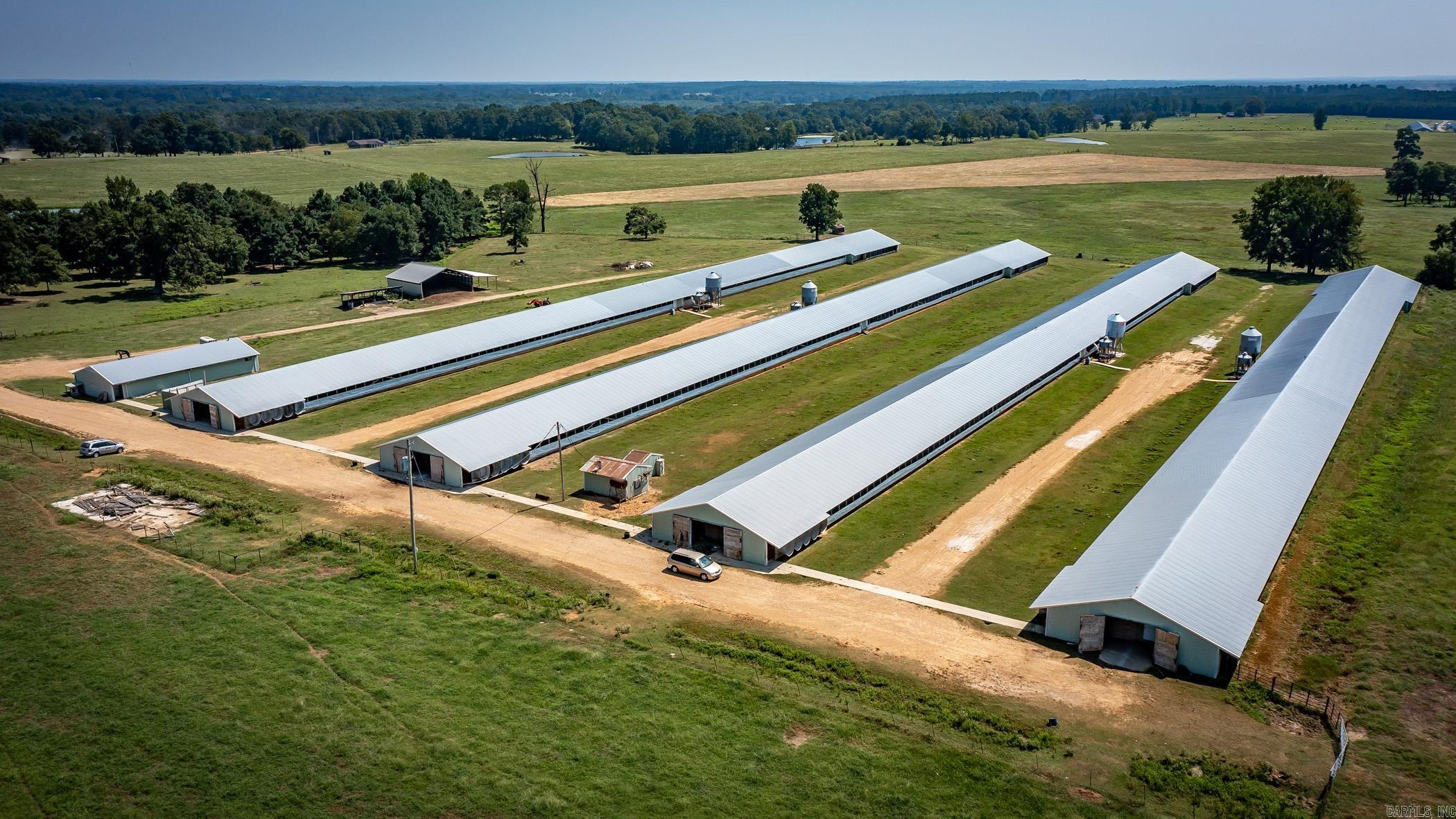Explore an exceptional investment opportunity in the heart of Hope, Arkansas. This property boasts four 50x600 chicken houses recently updated in 2024, two mobile homes for the workforce, and a 1734 Sq. Ft remodeled man home. With a current operation under a Foster Farms Contract, this offering presents a solid foundation for continued success. The property spans 24 acres of land, complete with a pole barn and fenced, cross-fenced areas. Positioned adjacent to the Foster Farms chicken hatchery and the University of Arkansas Southwest Research and Extension Center, this location offers strategic advantages for a thriving poultry operation. Unlock the potential of this turnkey investment in a prime agricultural environment.