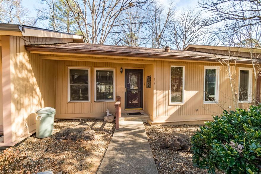 Great rental opportunity or permanent residence in this spacious two-level townhome.  Features of this well-maintained property include the primary bedroom on the entry level and Arkansas Room off the dining area.  Downstairs are two guest bedrooms, full bath, laundry room and generous storage area.  Conveniently located near the West Gate with nearby shopping; dining; and other services. Hot Springs Village amenities include 11 lakes; 9 golf courses; 30 plus miles of hiking trails; pickleball and tennis courts; state of the art fitness center; indoor and outdoor swimming pools; and more!   See Agent Remarks for additional details.