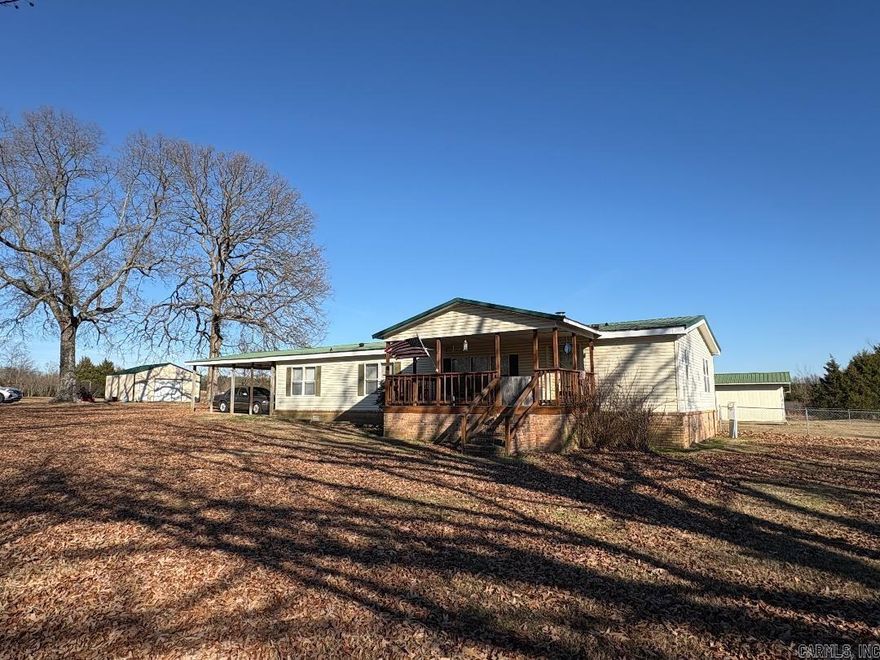 Welcome to Country Living with this Doublewide, Deer Frequent Property as you sit on the front Porch. Move in Ready. Sitting on 7.50 Acres with a New 24X24 Shop with Roll Up Door and New Fenced in Backyard. Property Features another Shop/ Storage Building with a Lean to Perfect for Chickens and a stall for Horses. City Water, Septic and Home is on Permanent Foundation. Gas Fireplace in Living Room and Butane Tank on Property. 2 Car Carport at end of home. Another Feature is a Separate Room for your Home Office. Ramp at the backdoor just installed recently. Property Features a Storm Shelter. See Agent Remarks. Survey in Docs