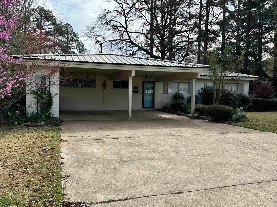 This is a great house in the perfect location near the college, restaurants and shopping. When you walk in the front door you are surprised at the size and openness of the first of two living areas. The family room has plenty of built-ins, a brick fireplace and plenty of light. Just off the family room is the dining area and Kitchen. The kitchen has plenty of storage, stainless appliances, including a double oven. The three bedrooms have quaint touches everywhere and the master bedroom has a newly updated in suite bathroom with large walk-in shower. The guest bath has been updated as well. Outside in the backyard you have a covered patio, potting shed/greenhouse and a wonderful yard full of various blooming shrubs and plants. This is a perfect home for a young family or someone downsizing.