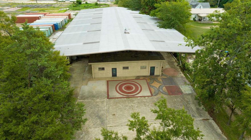 To be sold "As Is". ***8452 SF under roof ***1600 SF office with Central Heat & Air ***2 Large Storage rooms ***3 Overhead Freight doors ***Metal roof over structure  All information per appraisal by Scott Ellen/South Arkansas Appraisal Group.