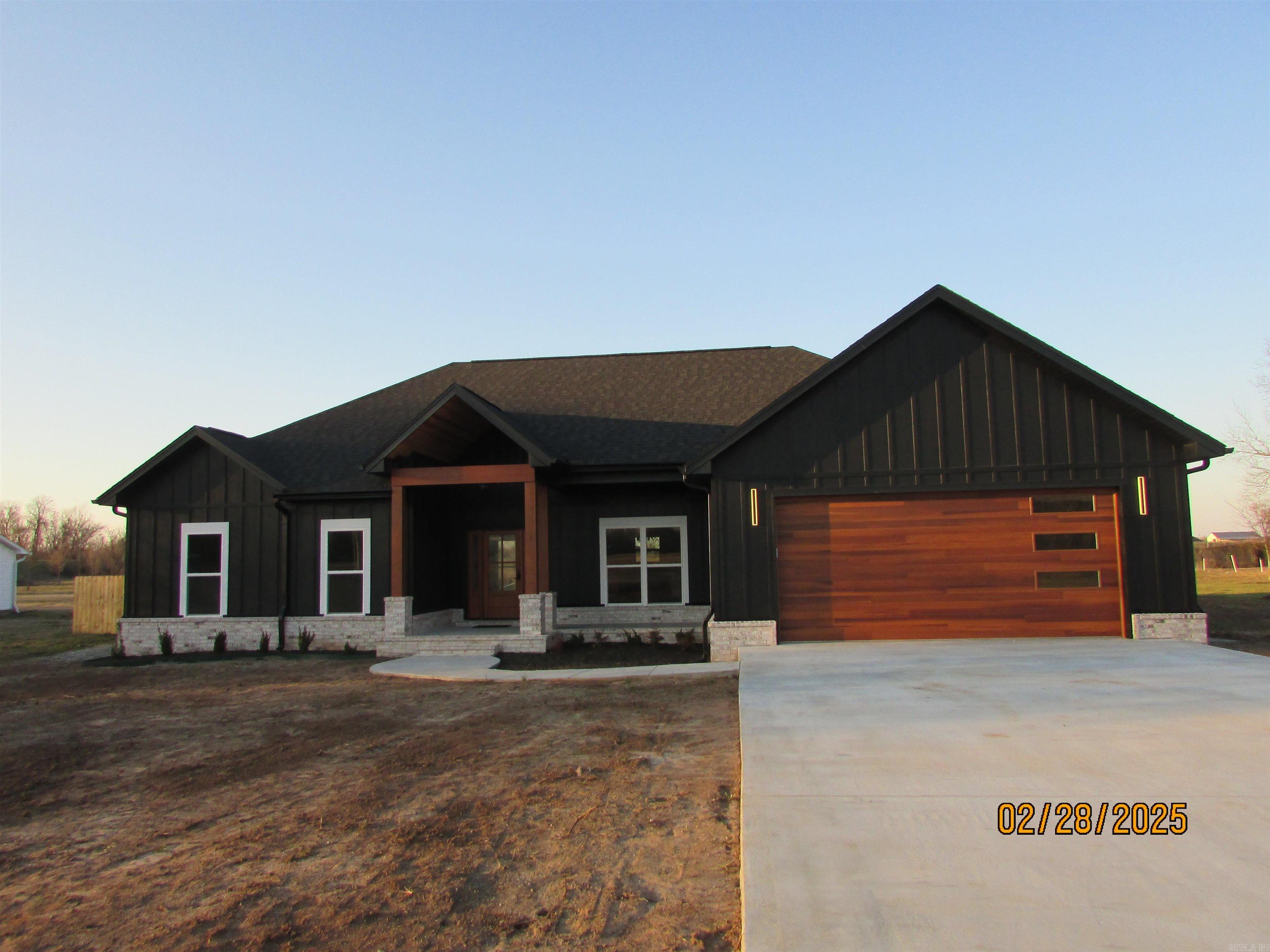Say hello to your dream home!! This custom built new construction has everything you could ask for. Open floor plan. Kitchen features a separate bar with ample counter space to whip up those gourmet meals. Dining area has extra storage for a coffee bar and also features a pot filler.. Spacious primary bedroom. Primary bathroom has separate double vanities, a free standing tub and a walk in shower. Large walk in closet with so much storage space. Split floor plan for extra privacy. Covered back patio great for BBQ's or just relaxing. All this on almost an acre. Don't drag your feet on this one.