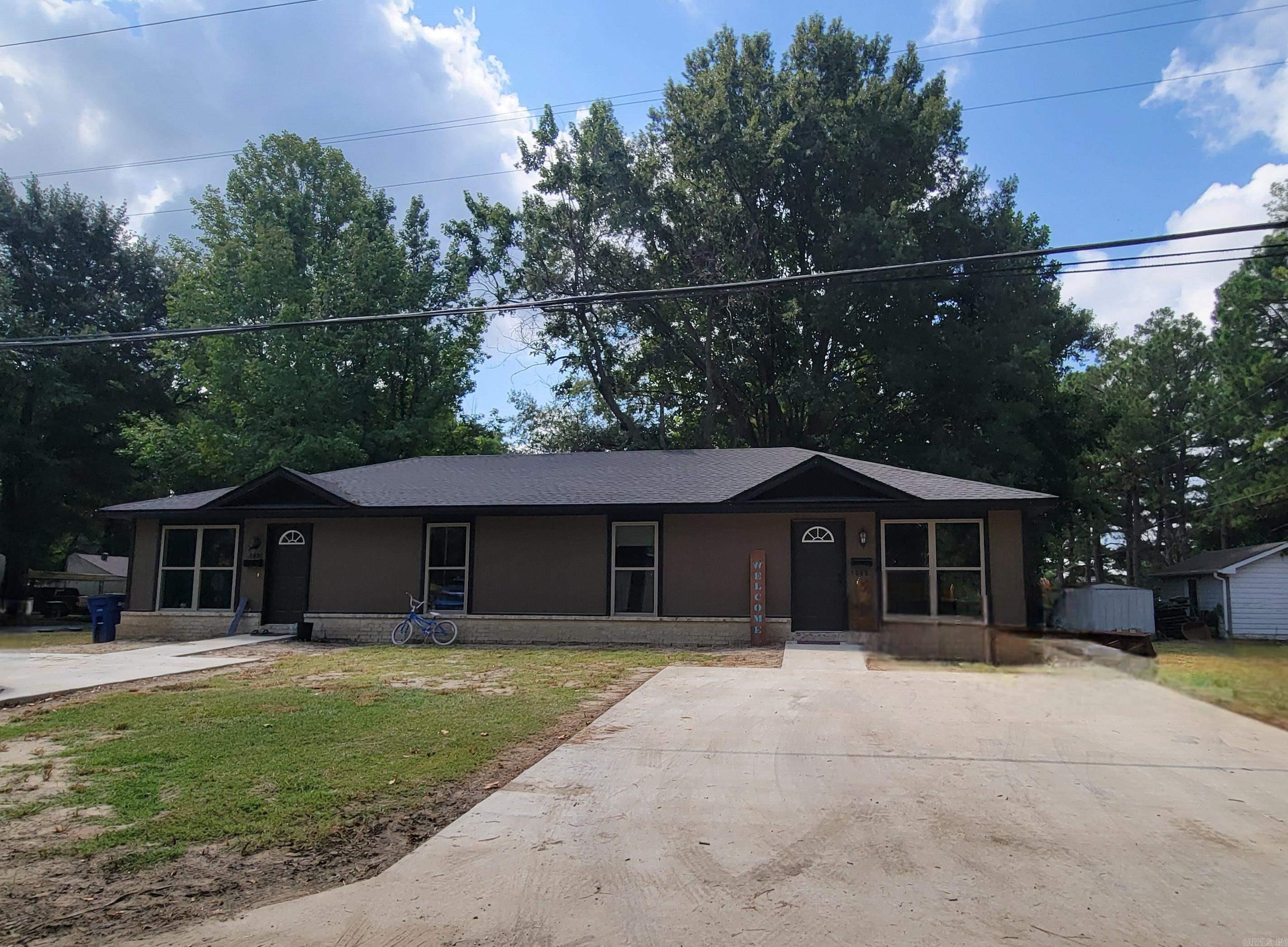 Duplex is close to year old, and both units are occupied. Acid-stained flooring and neutral paint colors throughout. Open concept floorplan. Kitchen with white cabinets and stainless-steel appliances. Located on corner lot.