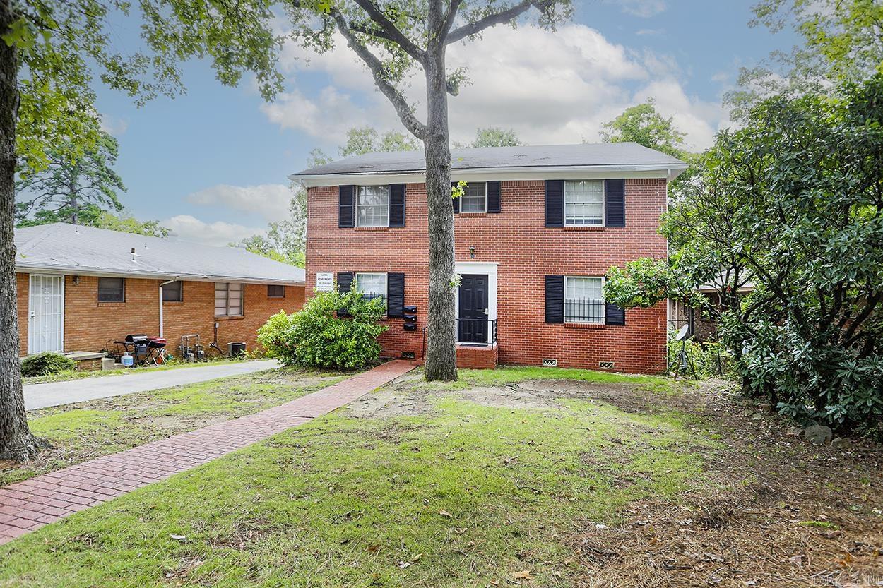 Handsome all red brick tri-plex in Hillcrest across from St. Vincent near MidTown Mall, UAMS, etc. Excellent opportunity to lease to nurses, med students, etc. Walk to restaurants, shopping nextdoor. Traditional 2 story Georgian building has large 2+ bedroom unit downstairs and two 1 bedroom units upstairs. Downstairs unit has central heat & air, living room, dining area, sep. den or office. Upstairs units have central heating & window units. Parking pads in front & covered parking in back. Common laundry room in back just for this triplex. New construction in the neighborhood.