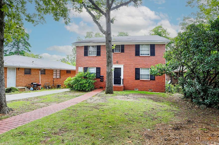 Handsome all red brick tri-plex in Hillcrest across from St. Vincent near MidTown Mall, UAMS, etc.  Excellent opportunity to lease to nurses, med students, etc.  Walk to restaurants, shopping nextdoor.  Traditional 2 story Georgian building has large 2+ bedroom unit downstairs and two 1 bedroom units upstairs.  Downstairs unit has central heat & air, living room, dining area, sep. den or office.  Upstairs units have central heating & window units.  Parking pads in front & covered parking in back.  Common laundry room in back just for this triplex.  New construction in the neighborhood.