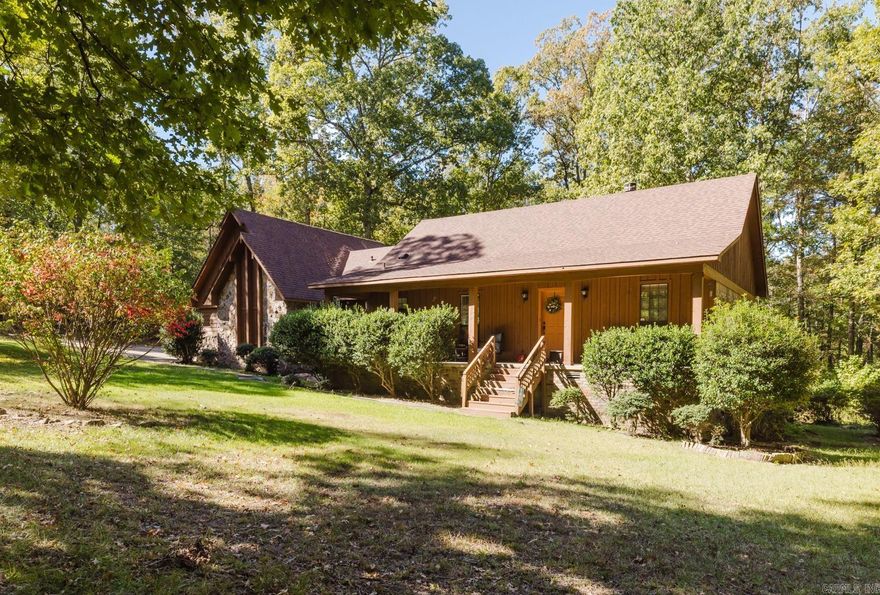 Nestled on 7 private wooded acres, this 3-bedroom, 2-bath home offers peaceful country living with timeless character and endless potential. The spacious living room features vaulted ceilings, exposed beams, and a cozy brick fireplace, creating a warm and inviting gathering space. Enjoy a separate formal dining room, large windows overlooking the trees, and a functional kitchen ready for your personal updates. The oversized primary suite includes a double vanity, soaking tub, and walk-in shower, while the large deck provides the perfect spot to relax and enjoy the serene surroundings. Property also includes a basement workshop/garage space, ideal for hobbies or storage and the crawl space has been professionally encapsulated for added peace of mind. A rare opportunity to own acreage with privacy, space, and room to make it your own. Home to be sold as-is.