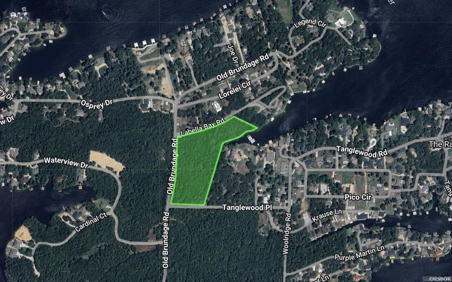 ATTENTION DEVELOPERS! Over 10 wooded acres with 400+ feet of Lake Hamilton frontage in Lakeside School District. Situated outside the city limits, this property offers freedom from subdivision restrictions and incredible potential for development. The land features gentle, sloping terrain leading to a deep-water cove, ideal for building luxury residences or a multifamily community. Road frontage on Old Brundage, Tanglewood, and La Bella Bay enhances accessibility and adds flexibility for future design. Surrounded by multi-million-dollar homes, this tract presents an opportunity to create a high-end project or an exclusive retreat. Whether you envision short-term rental cabins, a luxury development, or a private estate, this property delivers unmatched potential in one of Hot Springs’ most desirable areas. All utilities available at the street.
