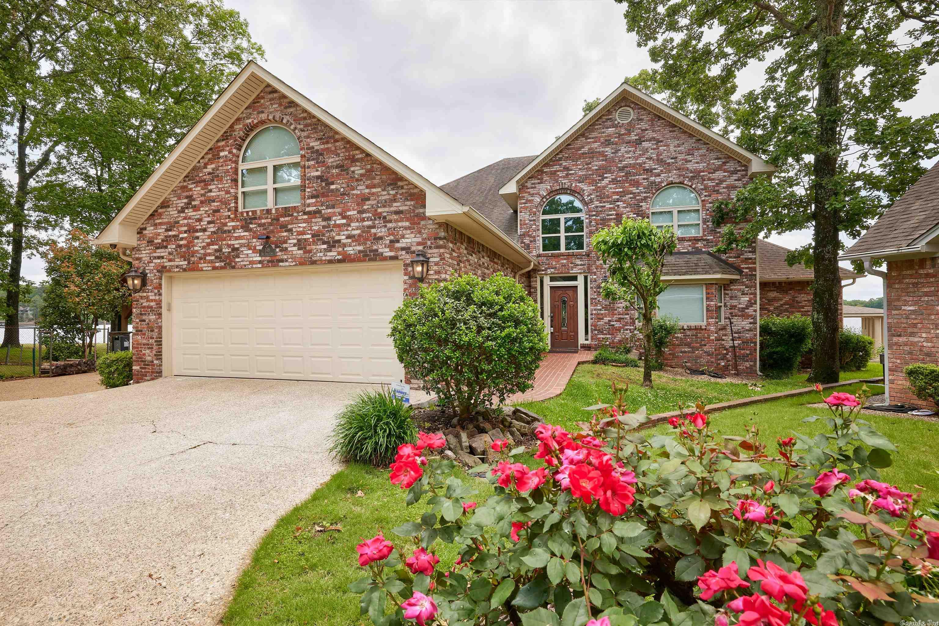 Spectacular 180 degree view of Lake Hamilton Arkansas. This home has it all, heated pool, covered outdoor grill area with fireplace, 20'x20' swim pier, 38'x38' custom built stationary dock with 2 overhead cradle boat lifts and 1 Seadoo lift. Comfortably decorated to enjoy a quite evening or a fun weekend with enough room for everyone! Selling completely furnished and includes million dollar view! No Short Term Rentals (see deed restrictions).