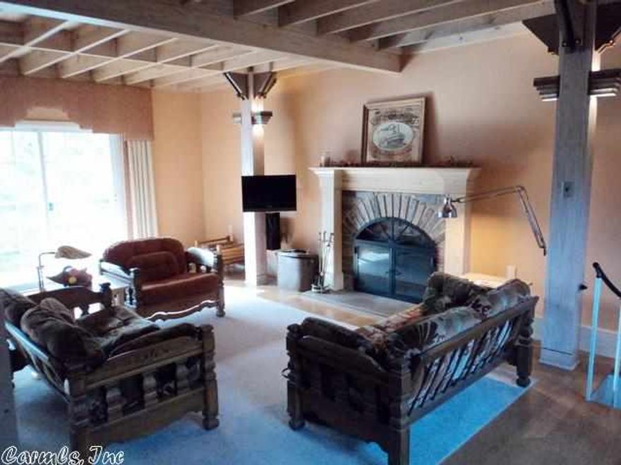 Unique architectural designed river home with a suspended enclosed walkway from the main home to the guest house.  The main home features geothermal heat and air, central vacuum, stainless steel appliances, oak flooring, large basement workshop and a wood burning fireplace.  The guest house has a loft and a shop/artist's studio or can be used as a rental for extra income.  All within walking distance to the water's edge.  A must see!