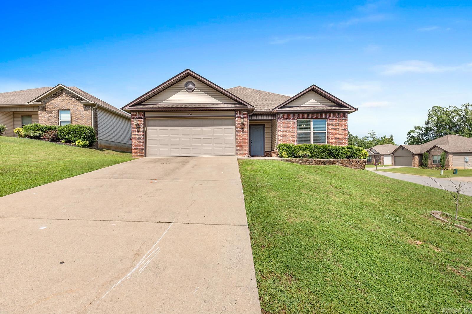 Don't miss out on this stunning 3-bedroom, 2-bathroom home in a welcoming and picturesque neighborhood. This residence boasts an open-concept living area with soaring ceilings, allowing an abundance of natural light to illuminate the space. The living area seamlessly flows into the dining room and modern kitchen, equipped with appliances. The master suite is a haven of comfort, spacious enough for a king-size bed, and features a luxurious jacuzzi tub, standalone shower, double vanity with ample lighting, and a generous walk-in closet. All bedrooms are conveniently accessible from the main living area. The 2-car garage, complete with a tool bench area, is perfect for projects and vehicle storage. The partially covered outdoor patio and spacious corner lot provide ample space for entertaining friends and family. This beautiful home is a rare findādon't let it slip away!