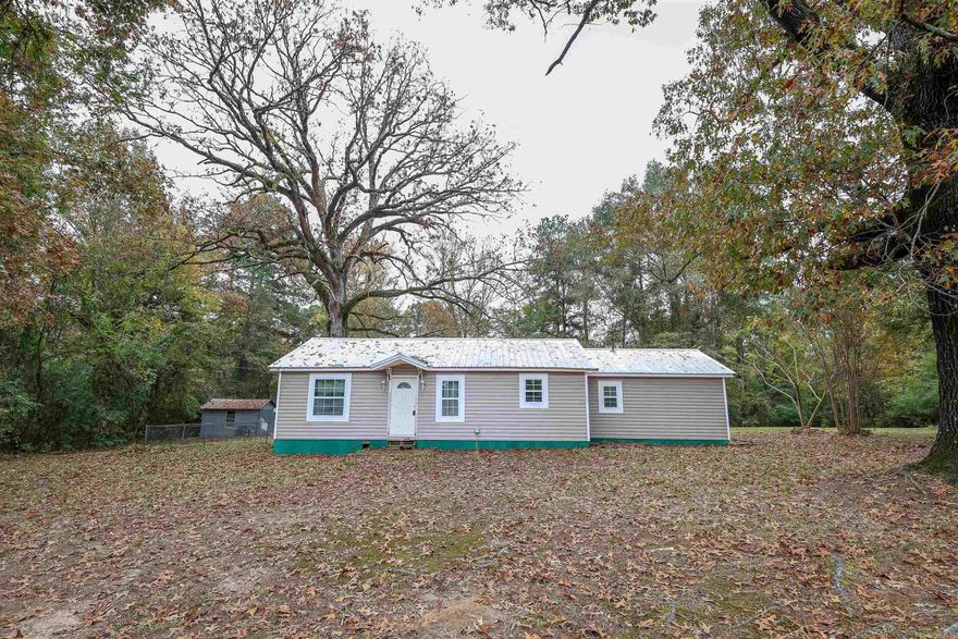 Charming 3 bedroom, 1 bath home outside of city limits in the Fairview area!  Sitting on a 1.5 acre parcel with a partially fenced yard, this property offers room for a garden, and showcases and space-efficient floor plan.  Enjoy the convenience of a brand new HVAC system to be installed prior to closing (with acceptable offer) and the durability of a metal roof.  Ideal for those seeking a cozy retreat with a touch of nature.