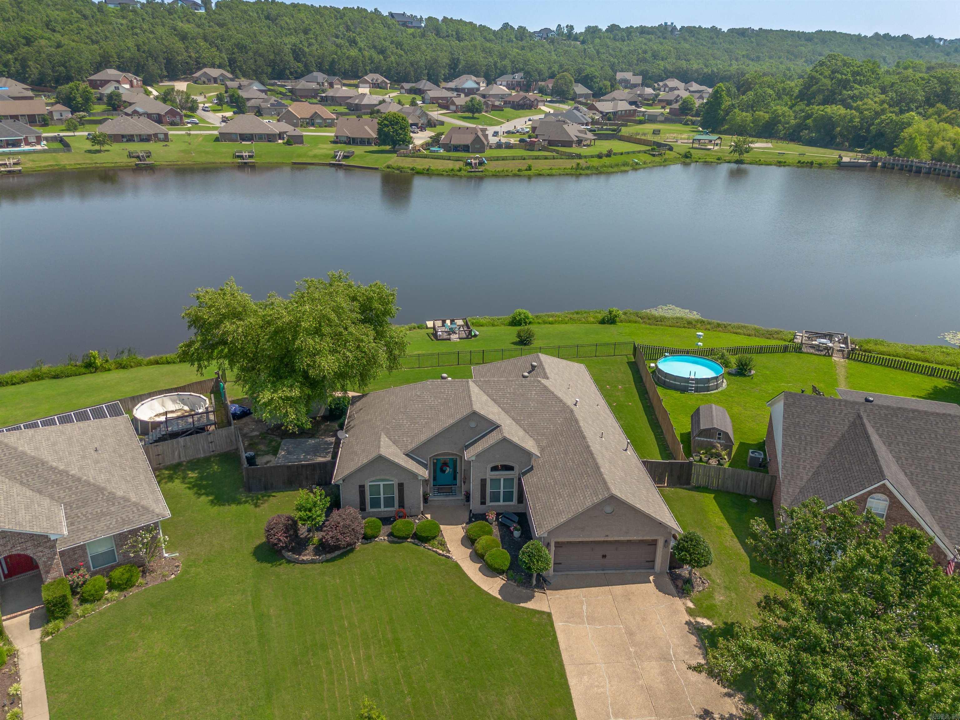 A beautiful lake front 4 bed 2 bath home right in the heart of Magness Creek! This home has many beautiful features with an updated kitchen, stainless steel stove and dishwasher, granite countertops, and a farm sink. The primary bedroom is perfect size to fit a king bed with a large soaking tub, shower, and dual vanities. The other bedrooms are on the other side of the home giving a split living floor plan. Don't forget there is PLENTY of storage for all your needs. Enjoy looking at the lake from your sunroom or even on the dock & lets not forget about the heated and cooled "She-Shed" that is perfect for an office, game room, guest house or even storage. Don't miss this home!!! There is still time to enjoy some summer fun fishing, tanning and back yard entertainment!!! Lets make this place to call home for you and your family.