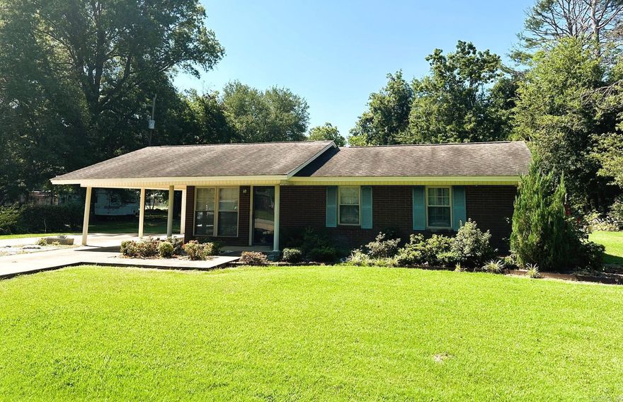 Great house for a great price! List price of $125,500. Recently Renovated eat in kitchen, with stainless steel appliances (refrigerator does convey) beautiful granite counter tops, and farm sink with a window overlooking backyard.  Large family room. Homes also has a front living room, or it could be used as dining room.  A wall was taken down in the guest bedroom to make one large bedroom.  The primary is great size with an ensuite bathroom featuring a walk-in shower, large walk-in closet. French doors leading out to the patio.  The yard is beautifully landscape, with two storage buildings that convey. One car carport with an extra parking pad.  This is such a cute property!