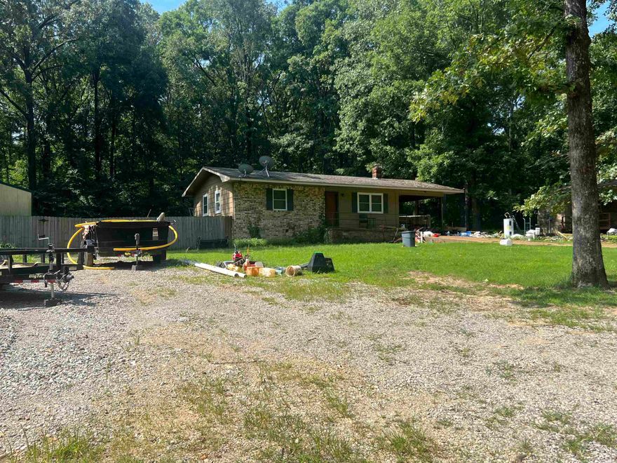 Check out this Cozy home nestled in a tree filled neighborhood just minutes outside of town! This home gives you a country feel while still having some close neighbors. Home is being sold AS IS. This home has potential to make your own touches! Call today for your private showing!